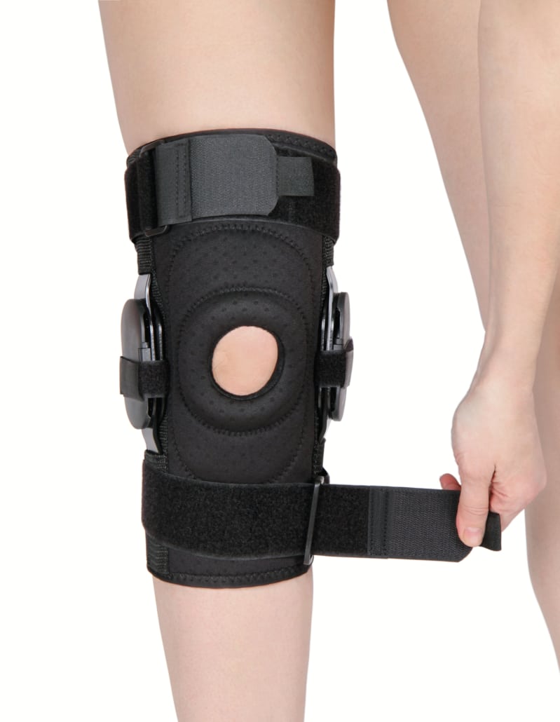 black knee support brace on patient’s leg